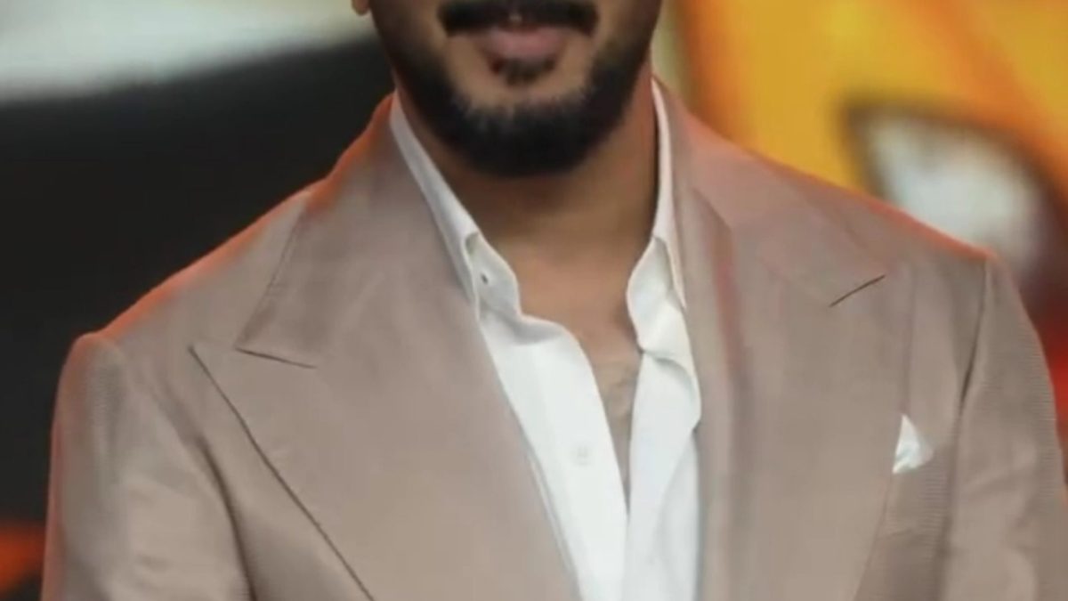 Dulquer Salmaan in tinted glasses and a beige suit