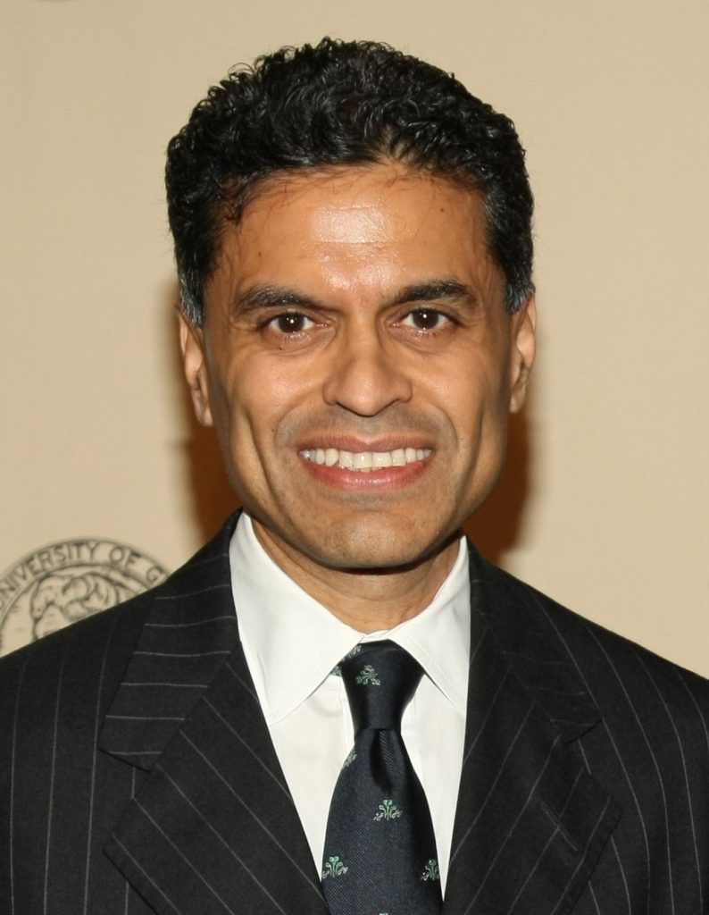 Fareed Zakaria in a dark suit at an awards event