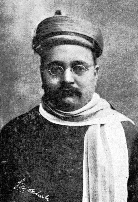A black-and-white portrait of Gopal Krishna Gokhale in a turban and glasses