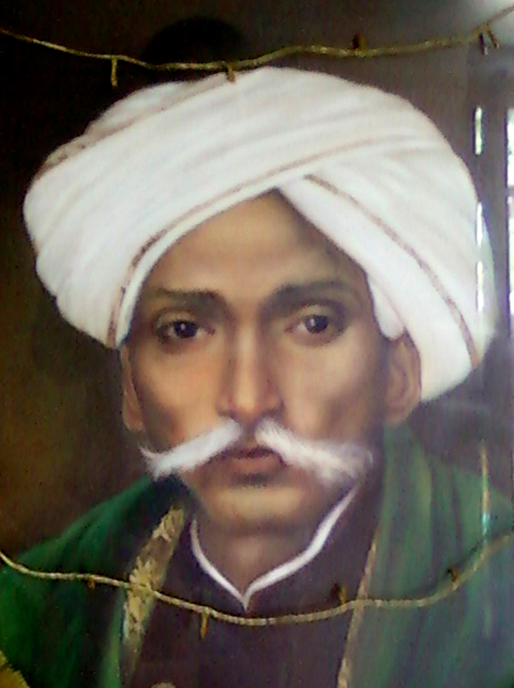 A painted portrait of Gurajada Apparao in a white turban with a large white moustache