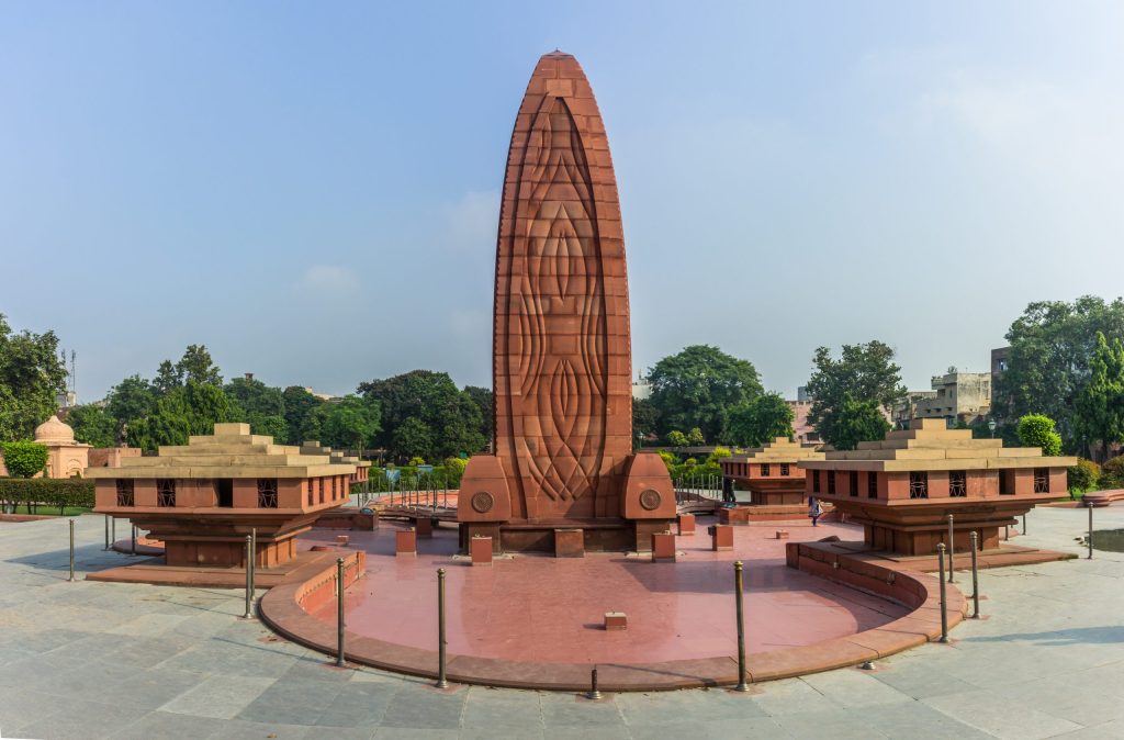 The red stone flame-shaped memorial at Jallianwala Bagh in Amritsar