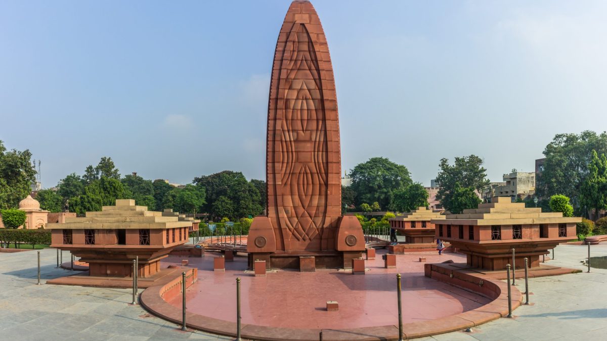 The red stone flame-shaped memorial at Jallianwala Bagh in Amritsar