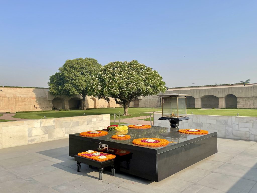 The black marble platform of Raj Ghat, the memorial to Mahatma Gandhi in New Delhi, with flowers on it