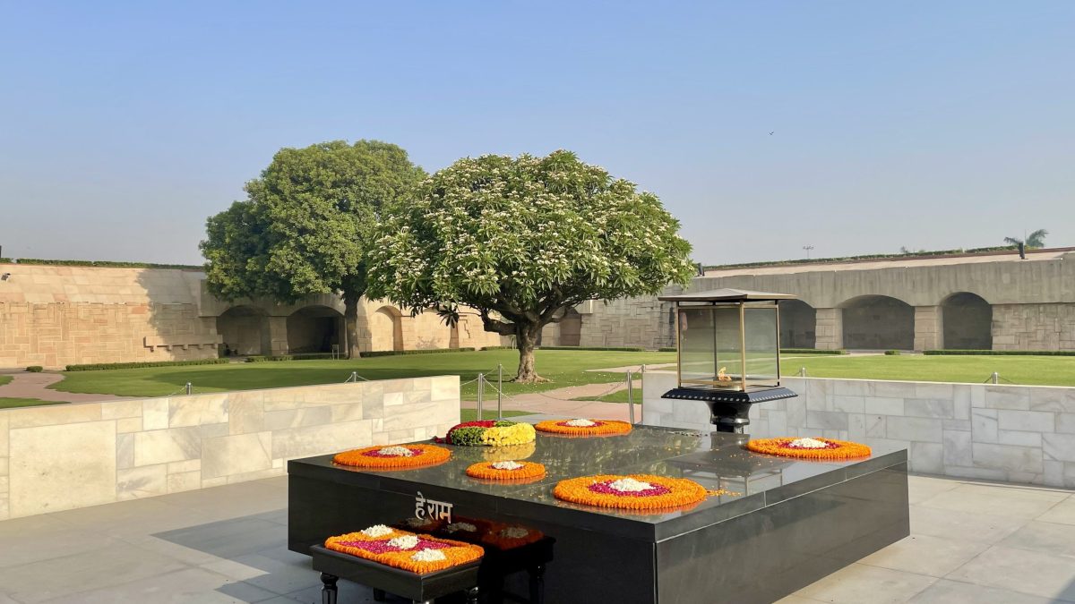 The black marble platform of Raj Ghat, the memorial to Mahatma Gandhi in New Delhi, with flowers on it