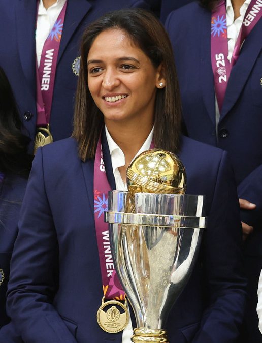 Harmanpreet Kaur holding the Women's World Cup trophy