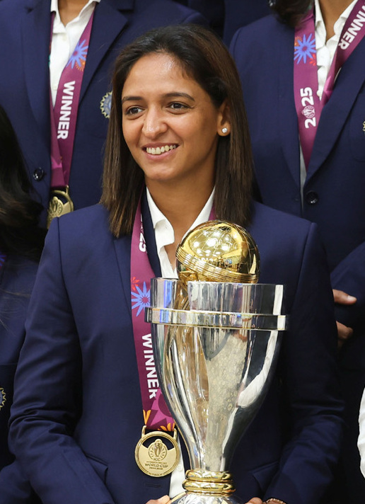 Harmanpreet Kaur holding the Women's World Cup trophy