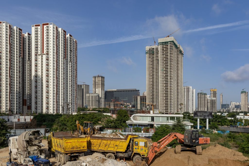 High-rise towers and construction vehicles in Hyderabad's Financial District