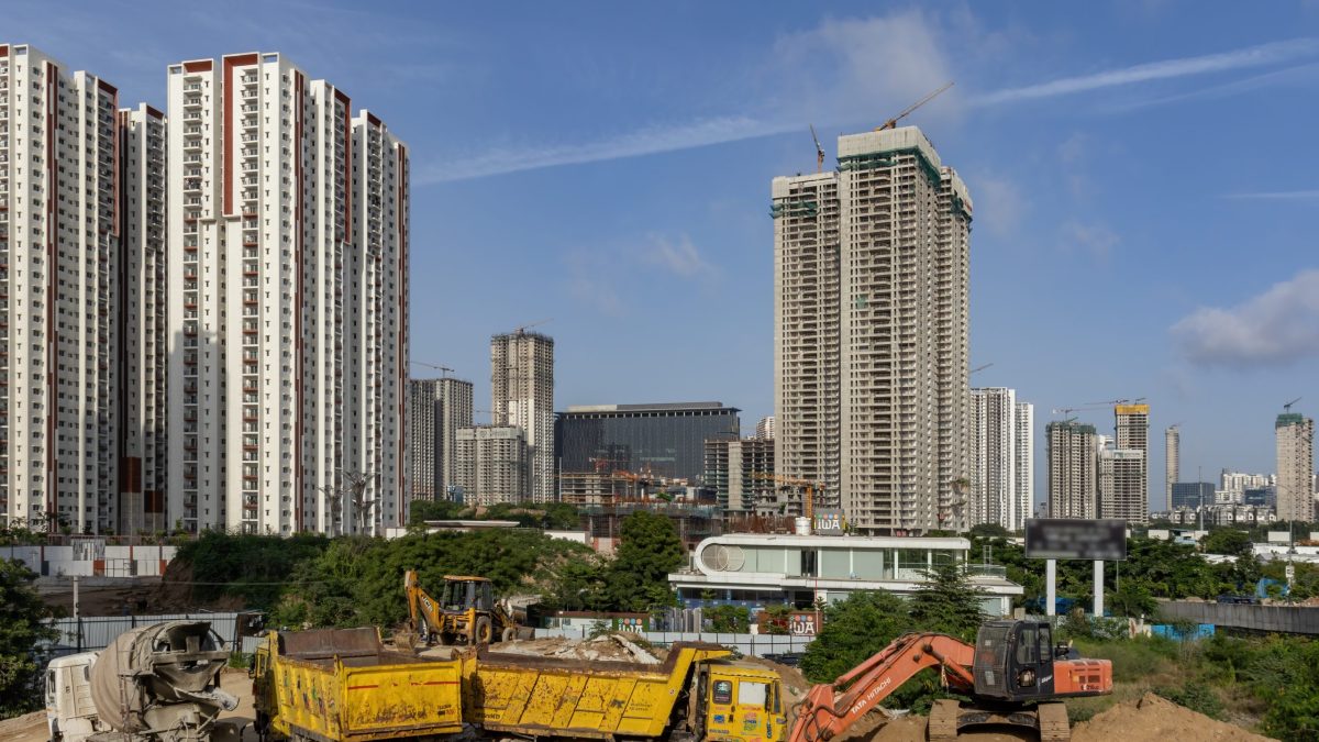 High-rise towers and construction vehicles in Hyderabad's Financial District