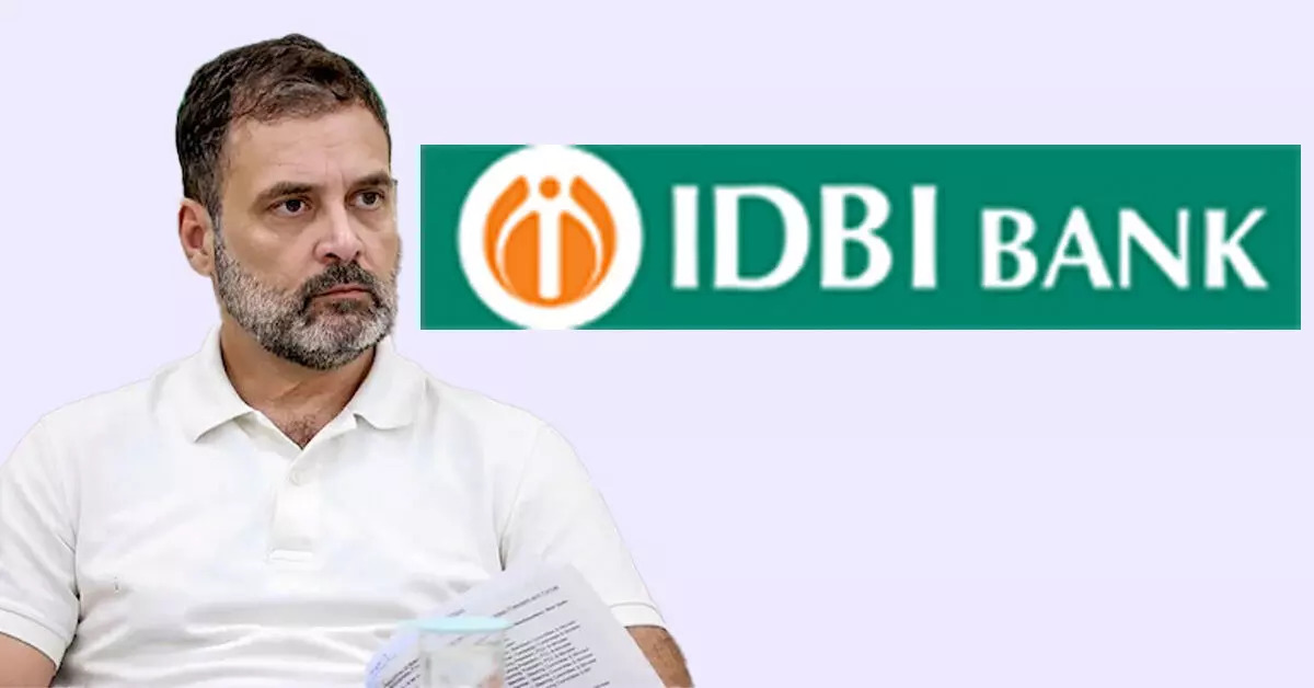 A man in a white polo shirt holding papers beside the IDBI Bank logo