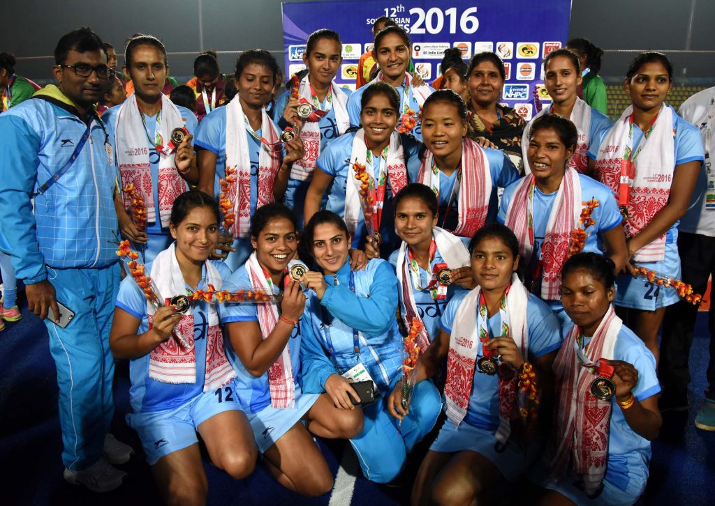The Indian women's hockey team celebrating with gold medals