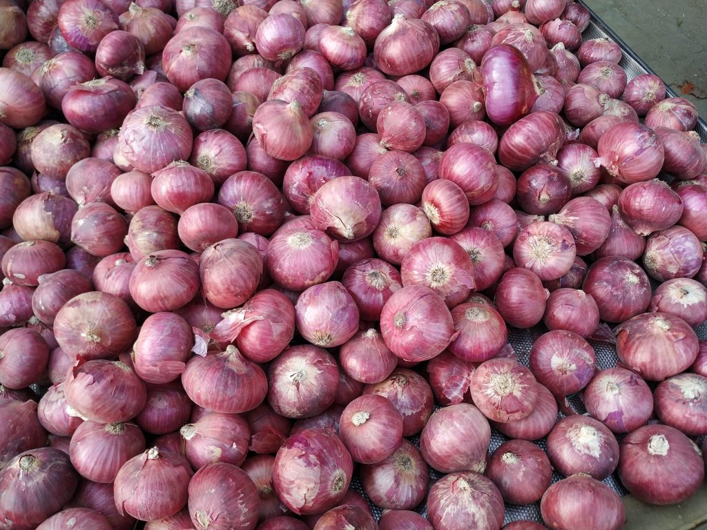 Onions piled on a trolley at an Indian market