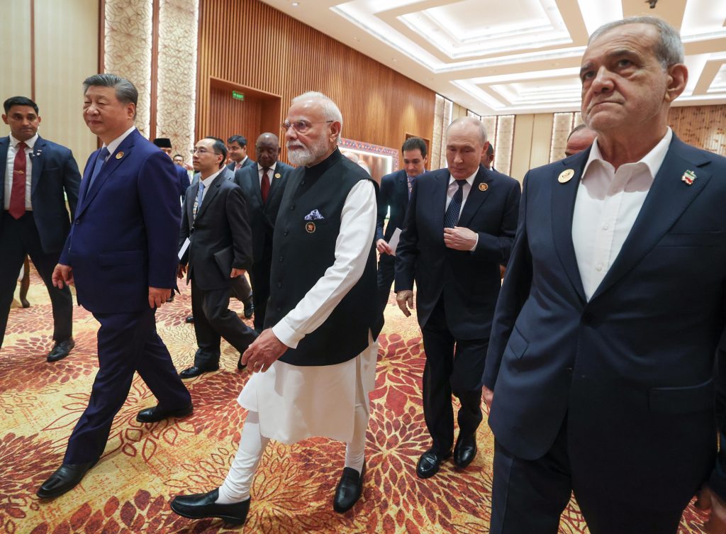 Leaders including Xi Jinping, Narendra Modi and Vladimir Putin walking at Bharat Mandapam