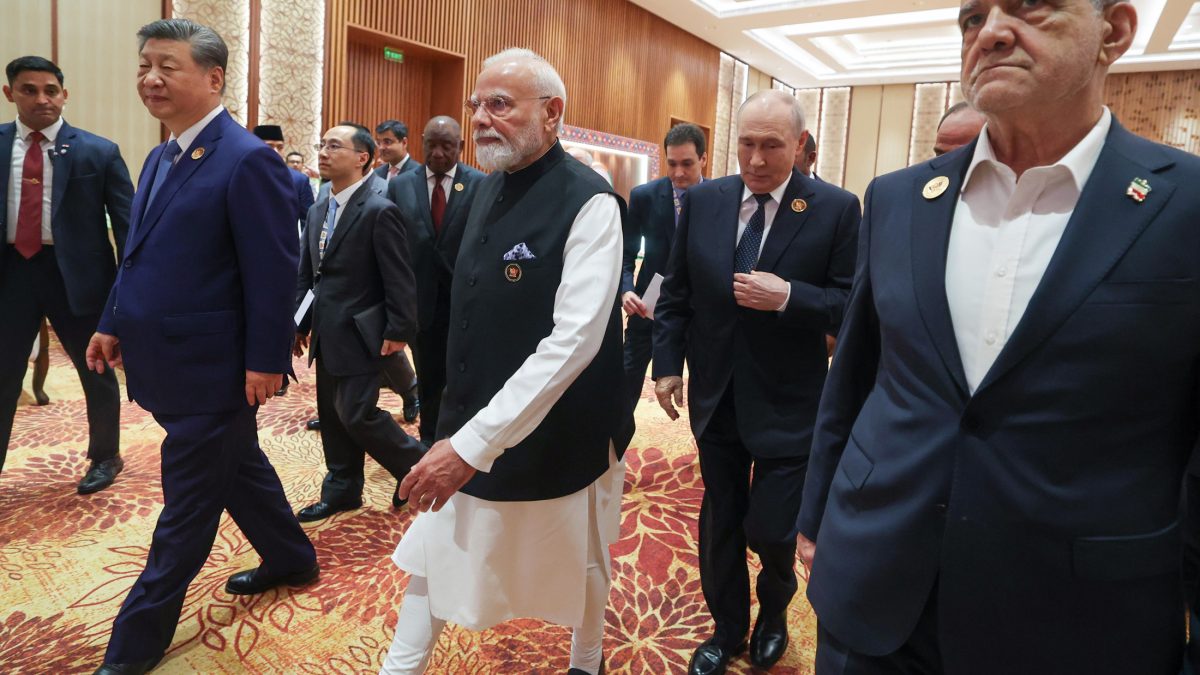 Leaders including Xi Jinping, Narendra Modi and Vladimir Putin walking at Bharat Mandapam