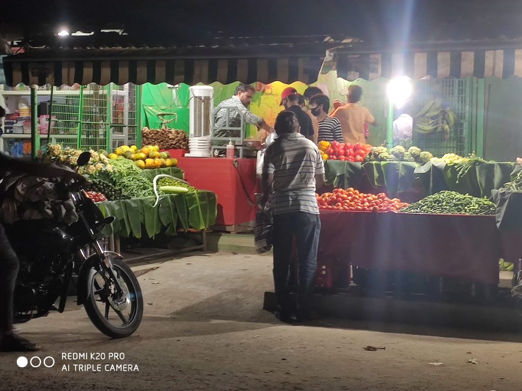 A wholesale vegetable shop at night in Rajahmundry
