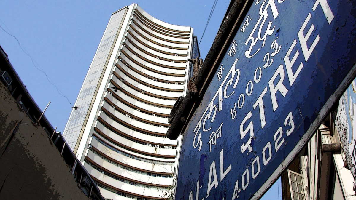 The BSE tower seen behind a Dalal Street signboard in Mumbai