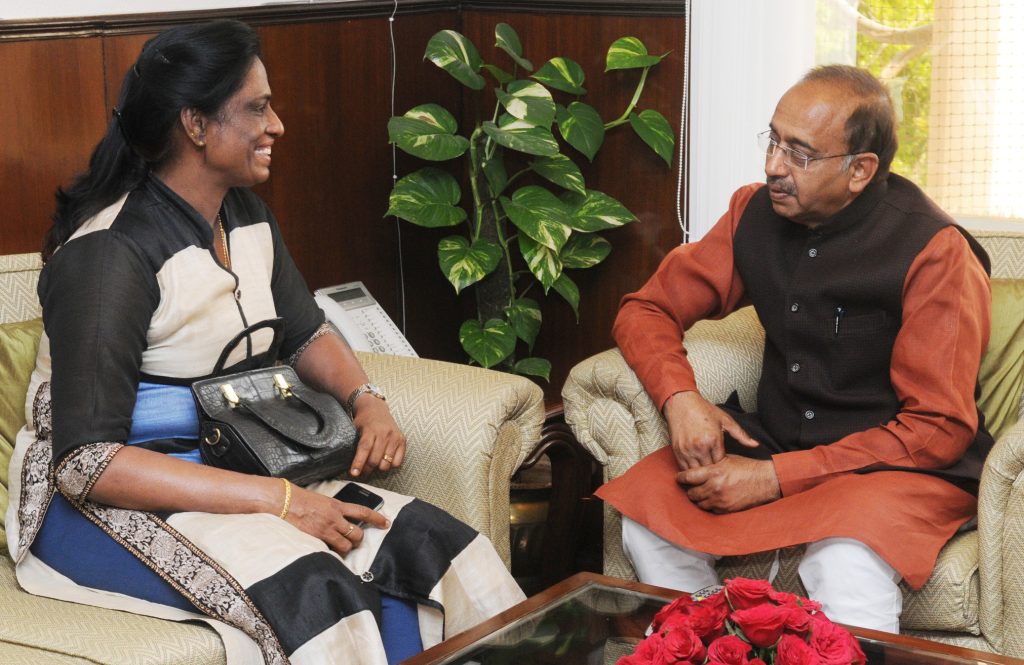 P. T. Usha seated in a meeting