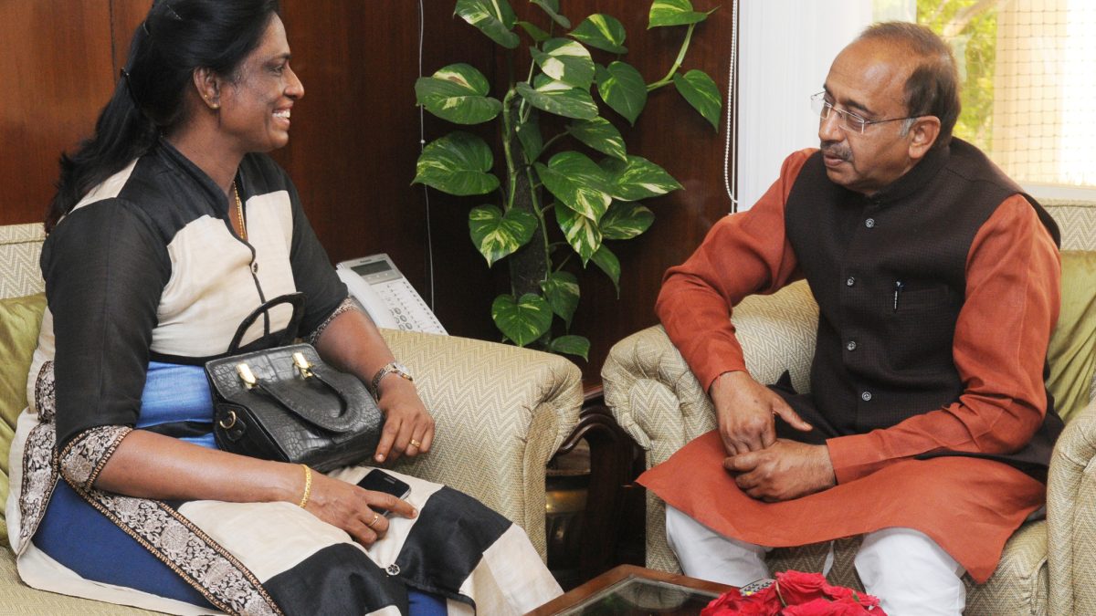 P. T. Usha seated in a meeting