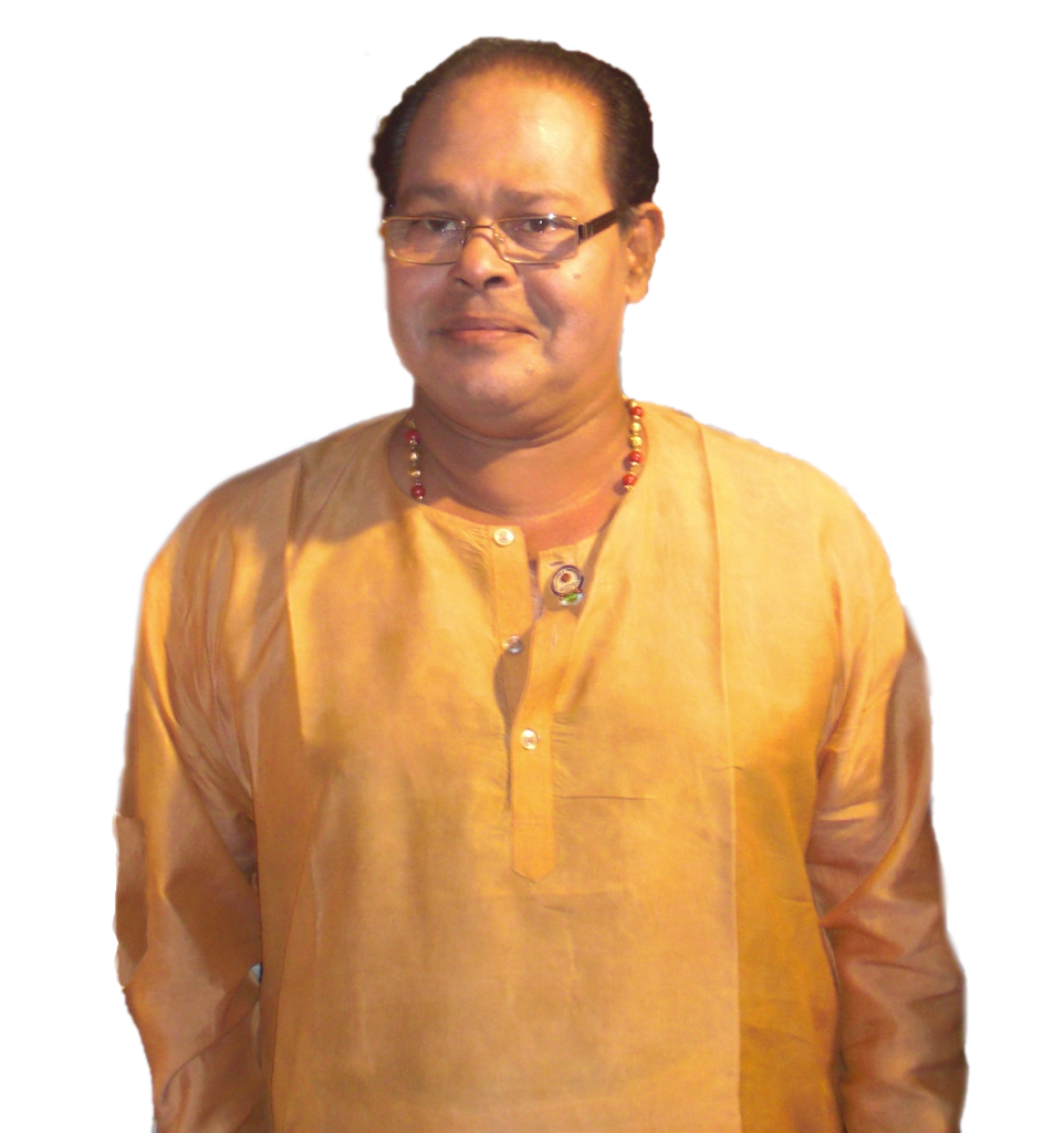 Innocent in glasses and a gold-coloured kurta, smiling