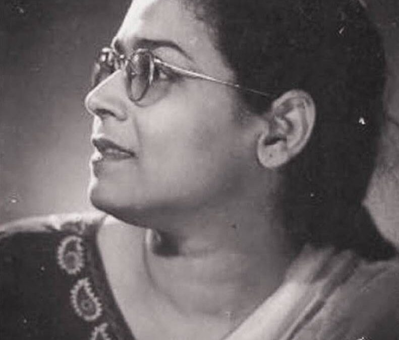 A black-and-white profile portrait of a young Ismat Chughtai in glasses