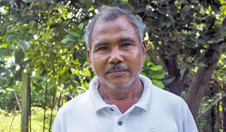 Jadav Payeng standing among the trees he planted