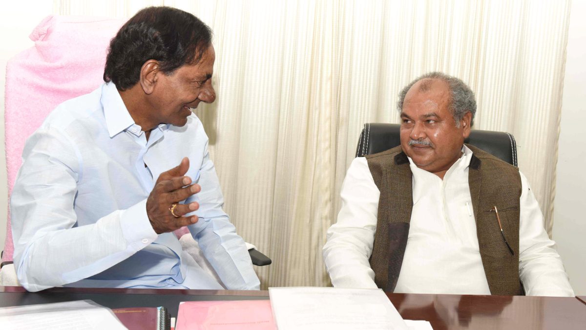 K. Chandrashekar Rao in white seated in conversation with Union Minister Narendra Singh Tomar
