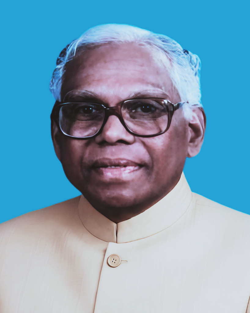 Official portrait of K. R. Narayanan in glasses and a white bandhgala against a blue background