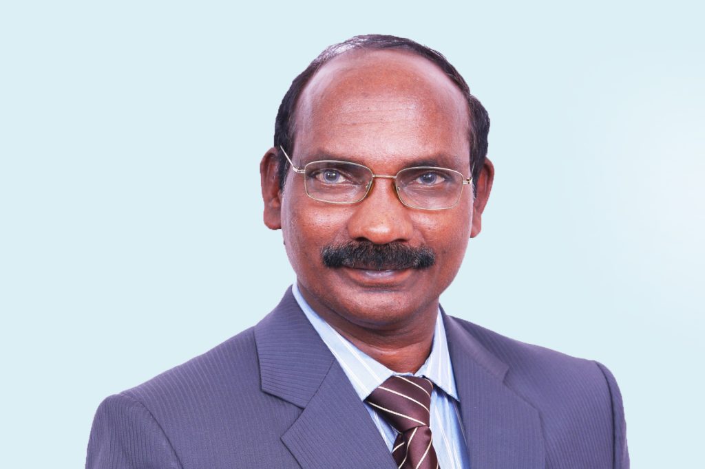 Portrait of K. Sivan in a suit and tie, smiling