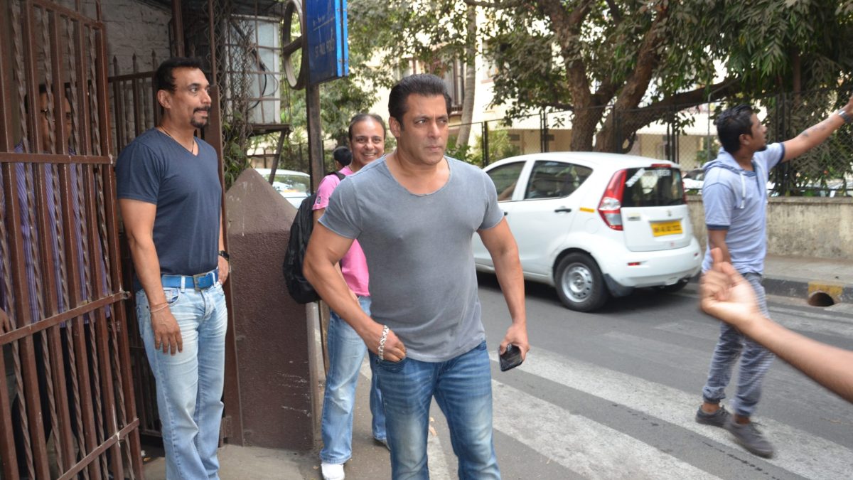Salman Khan standing outdoors in a grey T-shirt