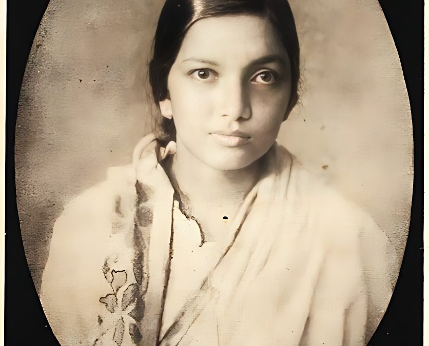 Oval sepia portrait of a young Kalpana Datta in a sari