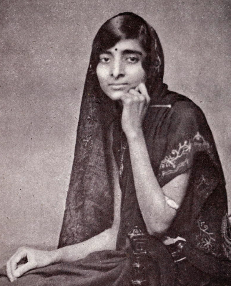 A black-and-white photograph of Kamala Nehru seated, her head covered with her sari