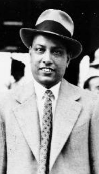 A black-and-white photograph of Kasturbhai Lalbhai in a hat and suit