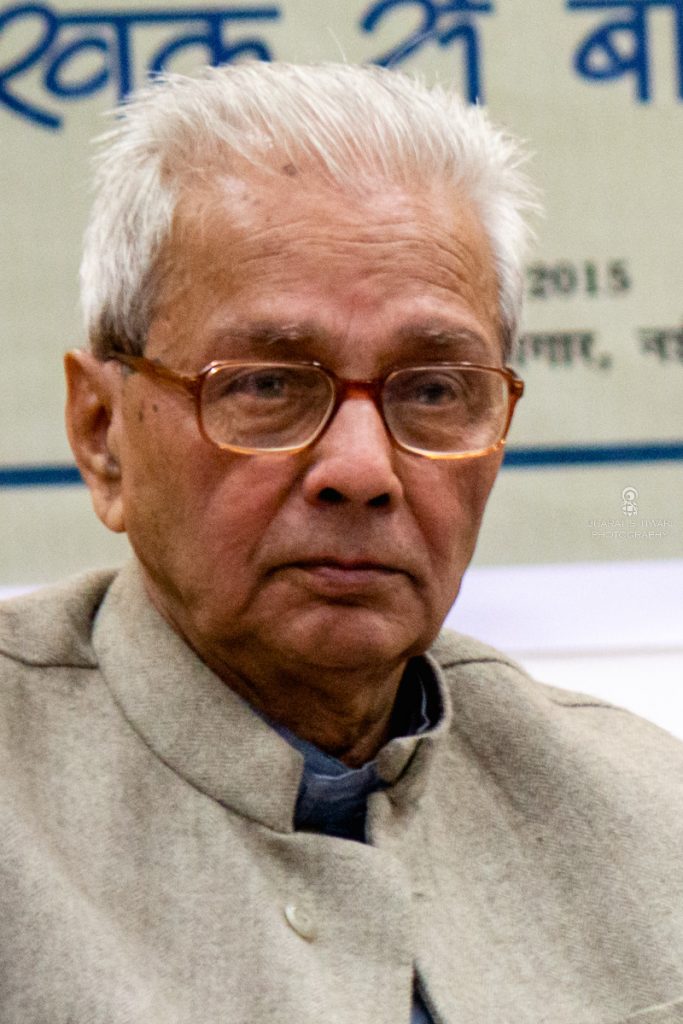 Kedarnath Singh with white hair and glasses, in a cream waistcoat
