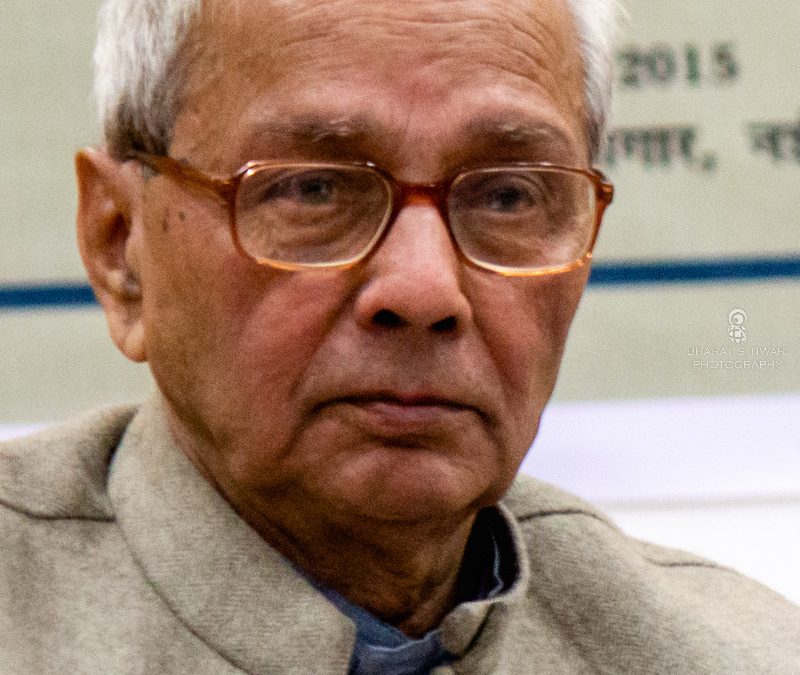 Kedarnath Singh with white hair and glasses, in a cream waistcoat