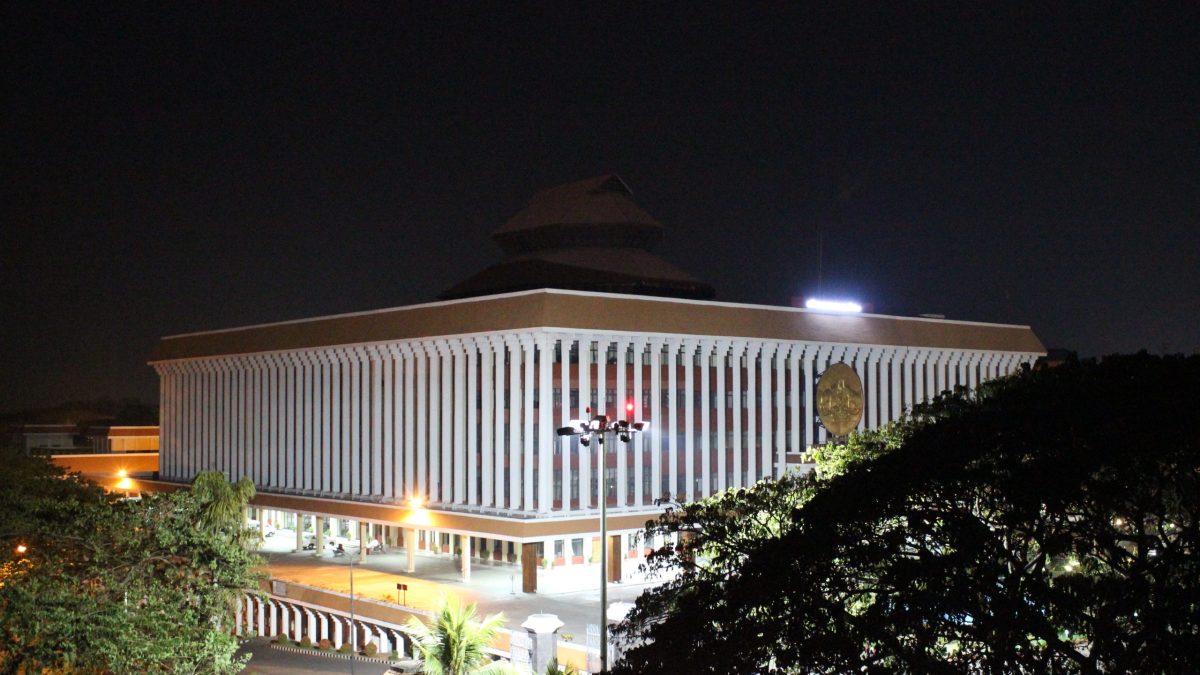 The Kerala Legislative Assembly building lit up at night in Thiruvananthapuram
