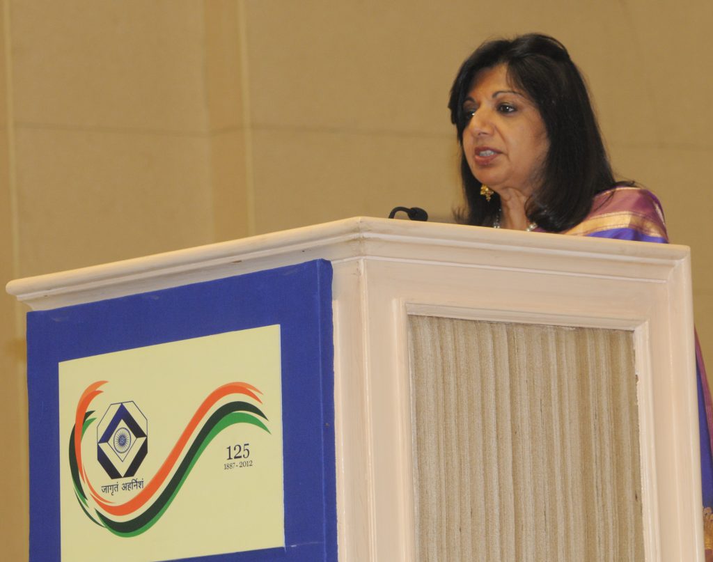 Kiran Mazumdar-Shaw speaking at a podium in New Delhi