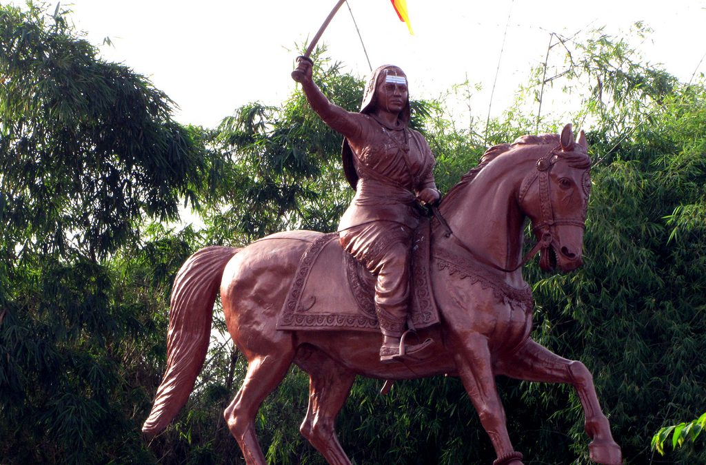 An equestrian statue of Kittur Chennamma holding a sword