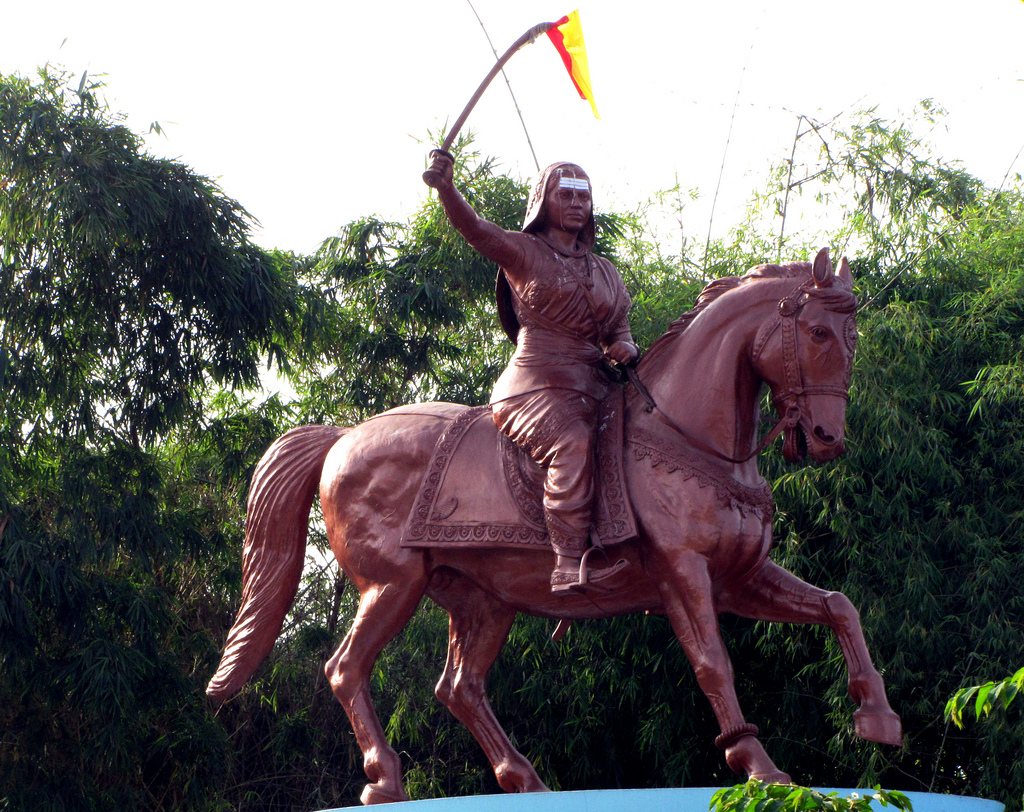 An equestrian statue of Kittur Chennamma holding a sword
