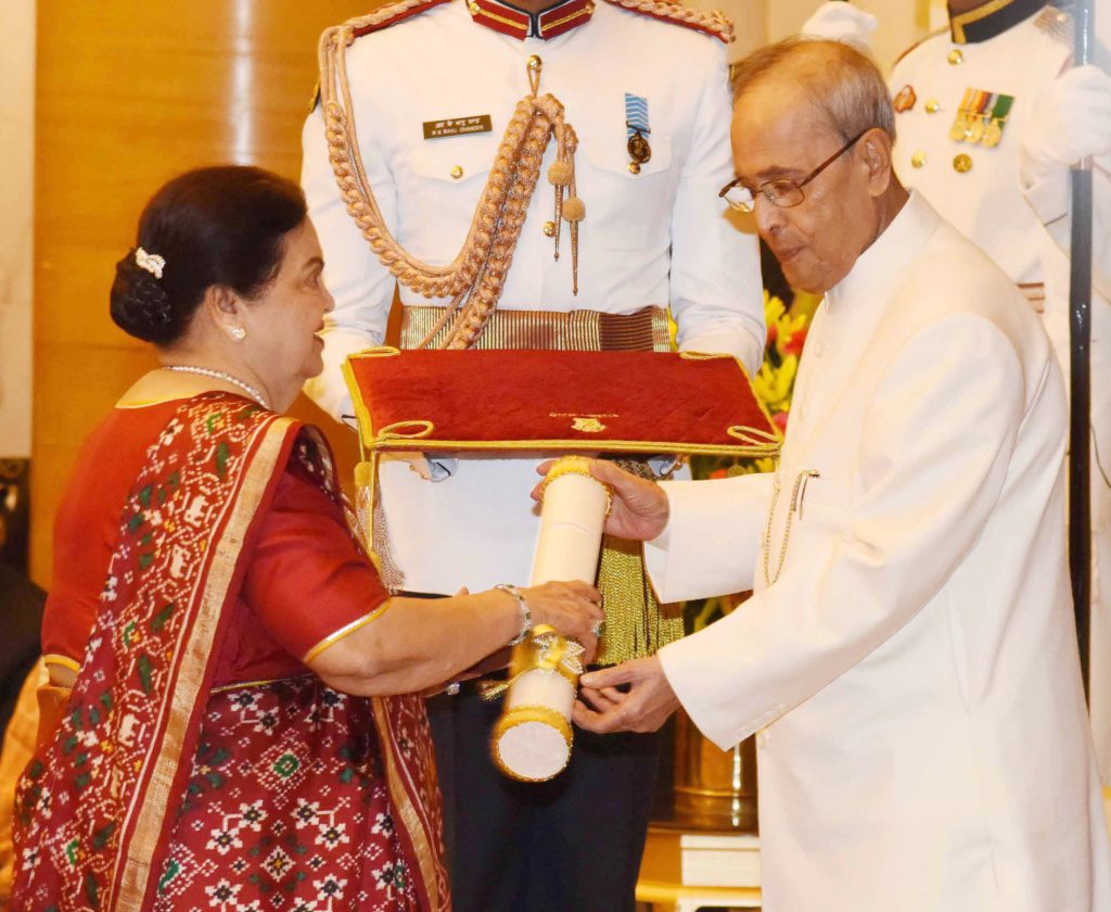 Kokilaben Ambani receiving the Padma Vibhushan from President Pranab Mukherjee