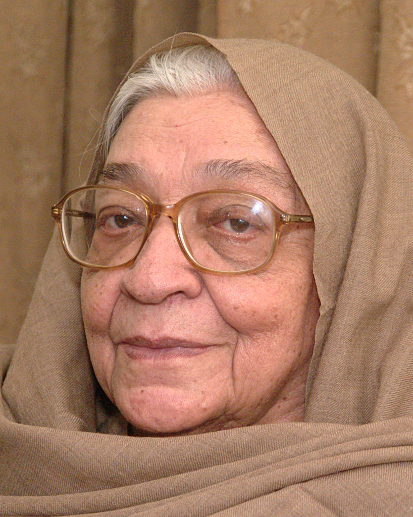 Krishna Sobti in glasses, her head covered with a shawl
