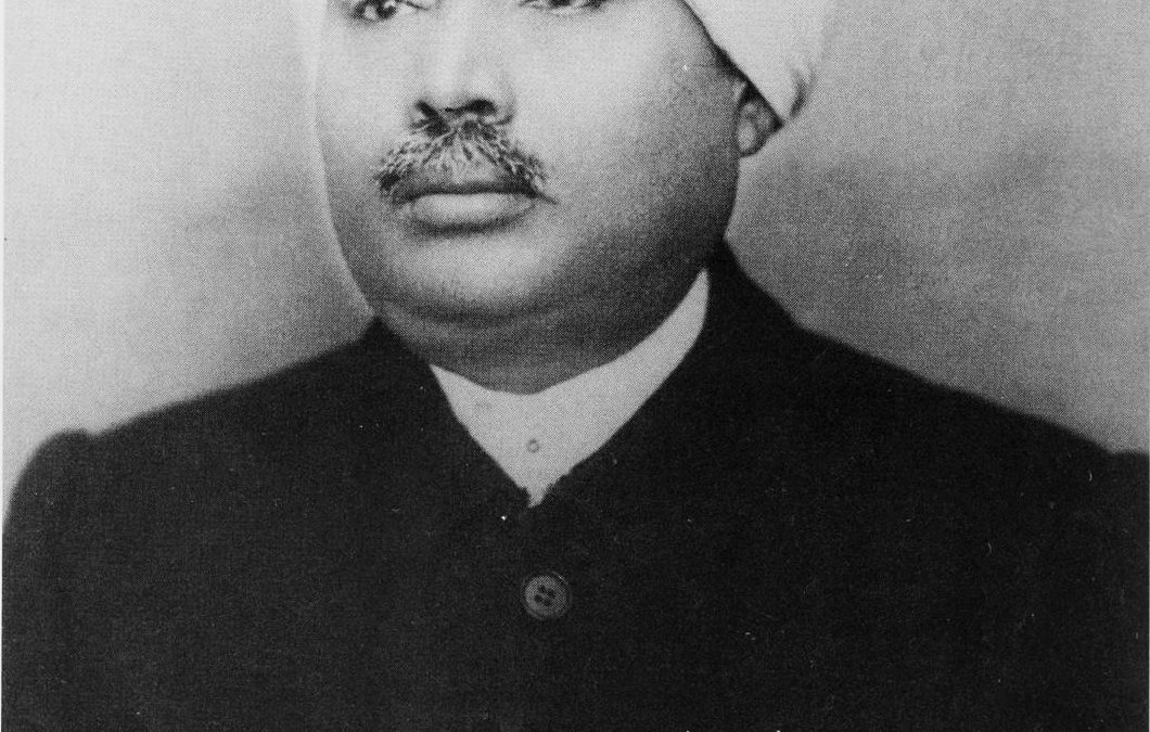 A black-and-white portrait of Lala Lajpat Rai in a turban and coat