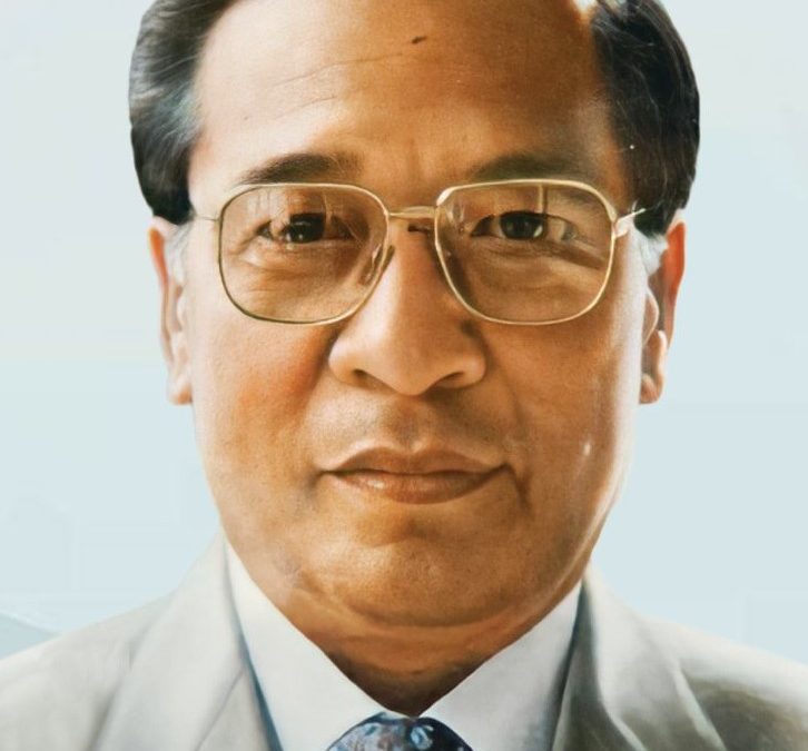 A portrait of Laldenga in a suit and tie