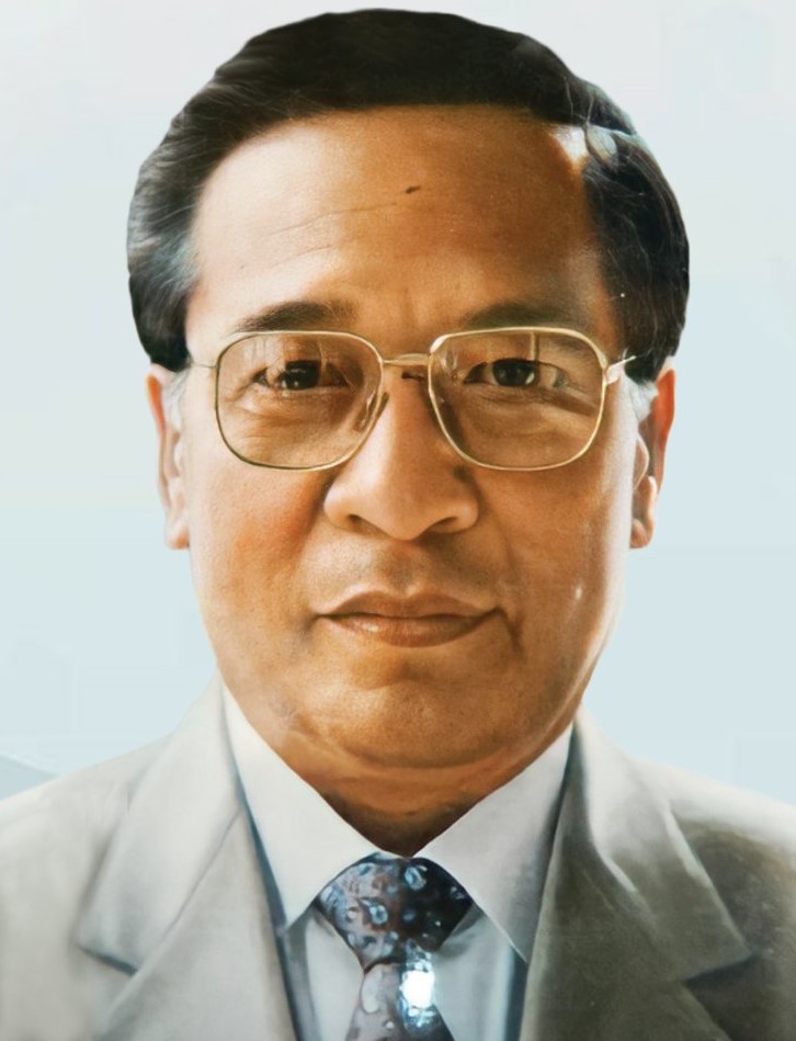 A portrait of Laldenga in a suit and tie