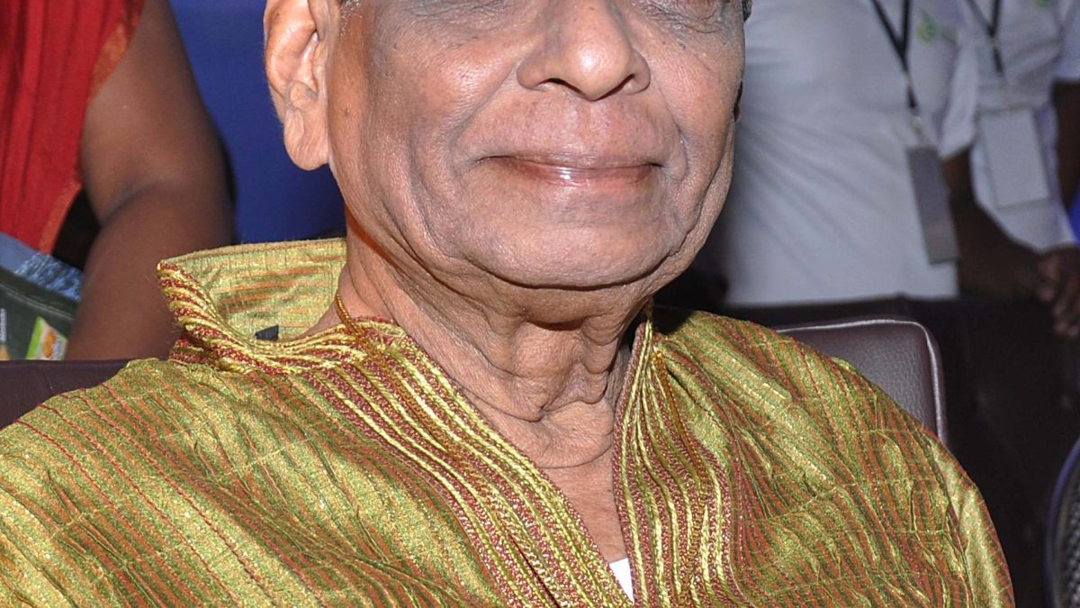 M. Balamuralikrishna with white hair, in a silk shirt