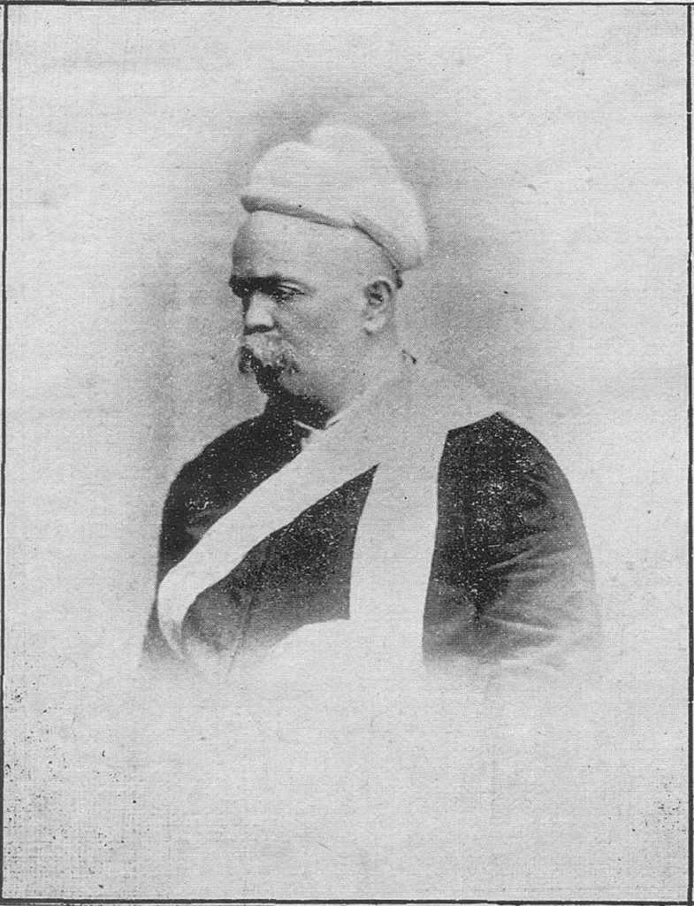An old printed portrait of Mahadev Govind Ranade in a turban