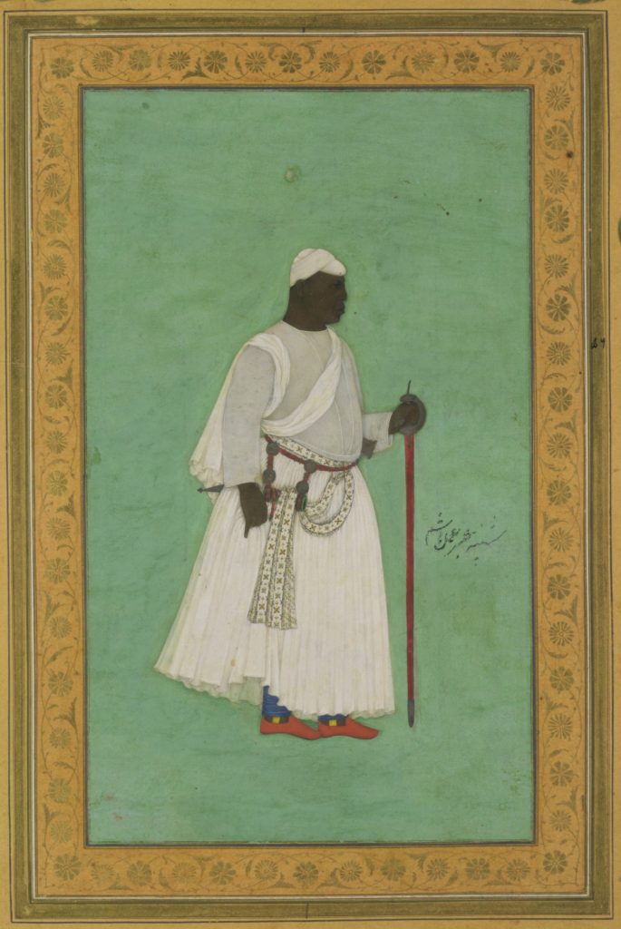 Mughal-style miniature of Malik Ambar standing in white robes holding a staff, on a green ground