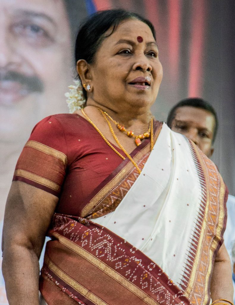 Manorama in a white and red silk sari at a public function