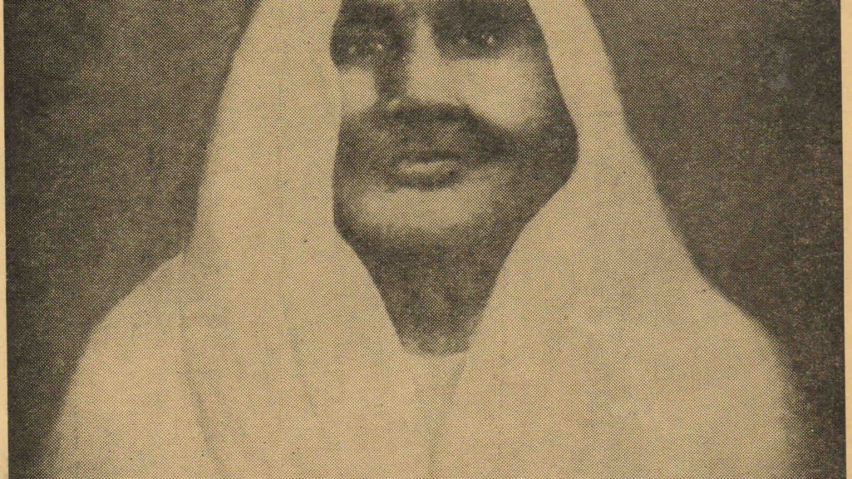 Sepia portrait of Matangini Hazra with a white sari drawn over her head