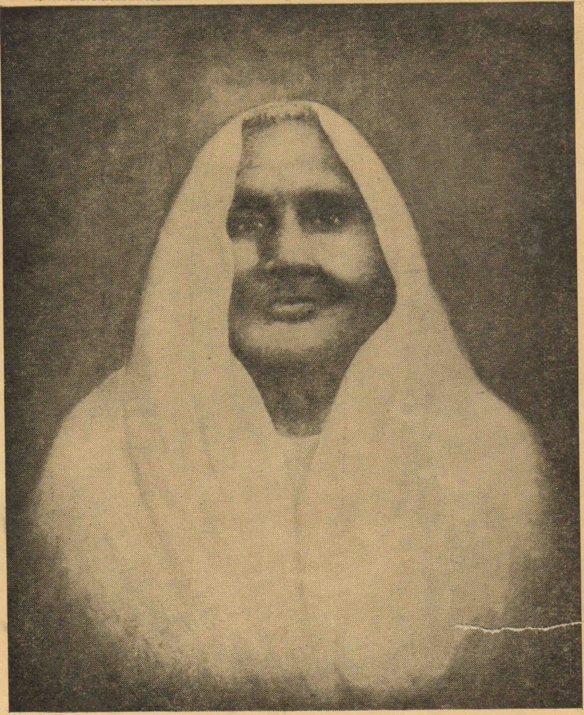 Sepia portrait of Matangini Hazra with a white sari drawn over her head