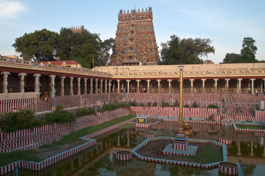A gopuram rising above the temple tank of the Meenakshi Temple in Madurai