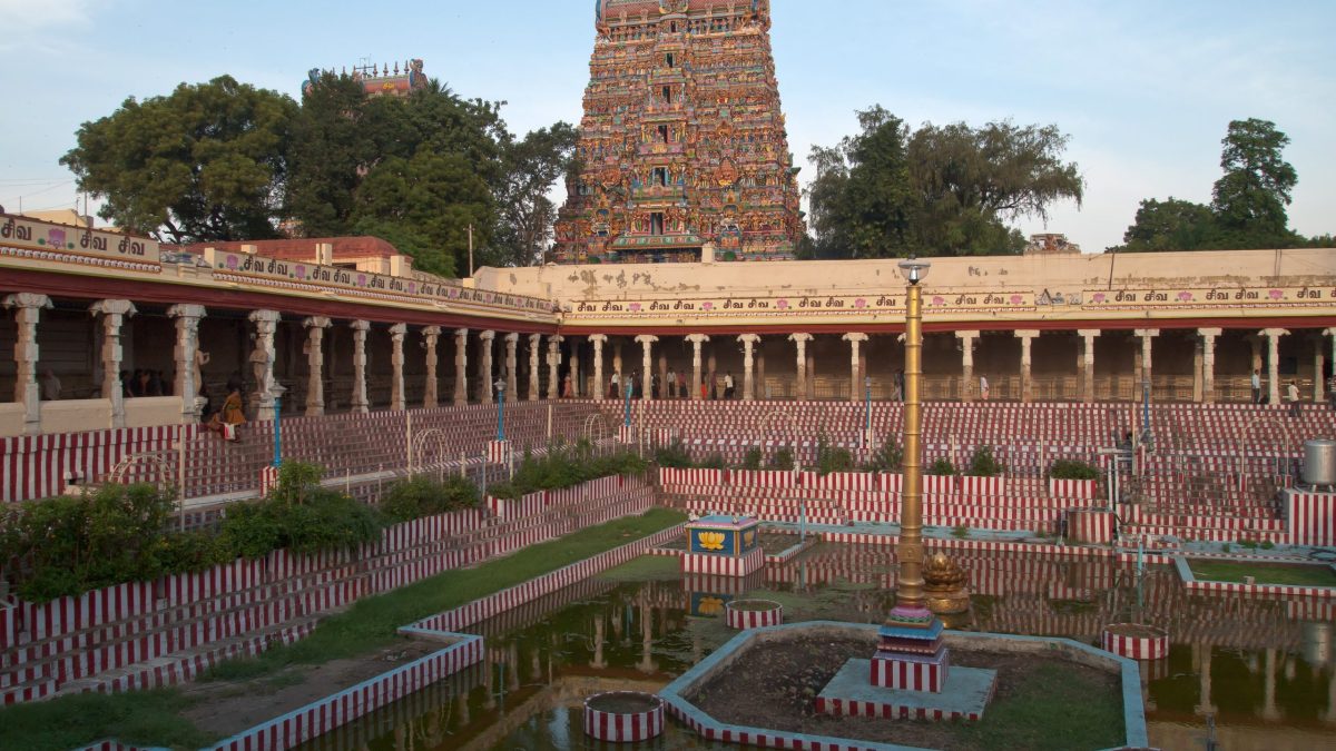 A gopuram rising above the temple tank of the Meenakshi Temple in Madurai
